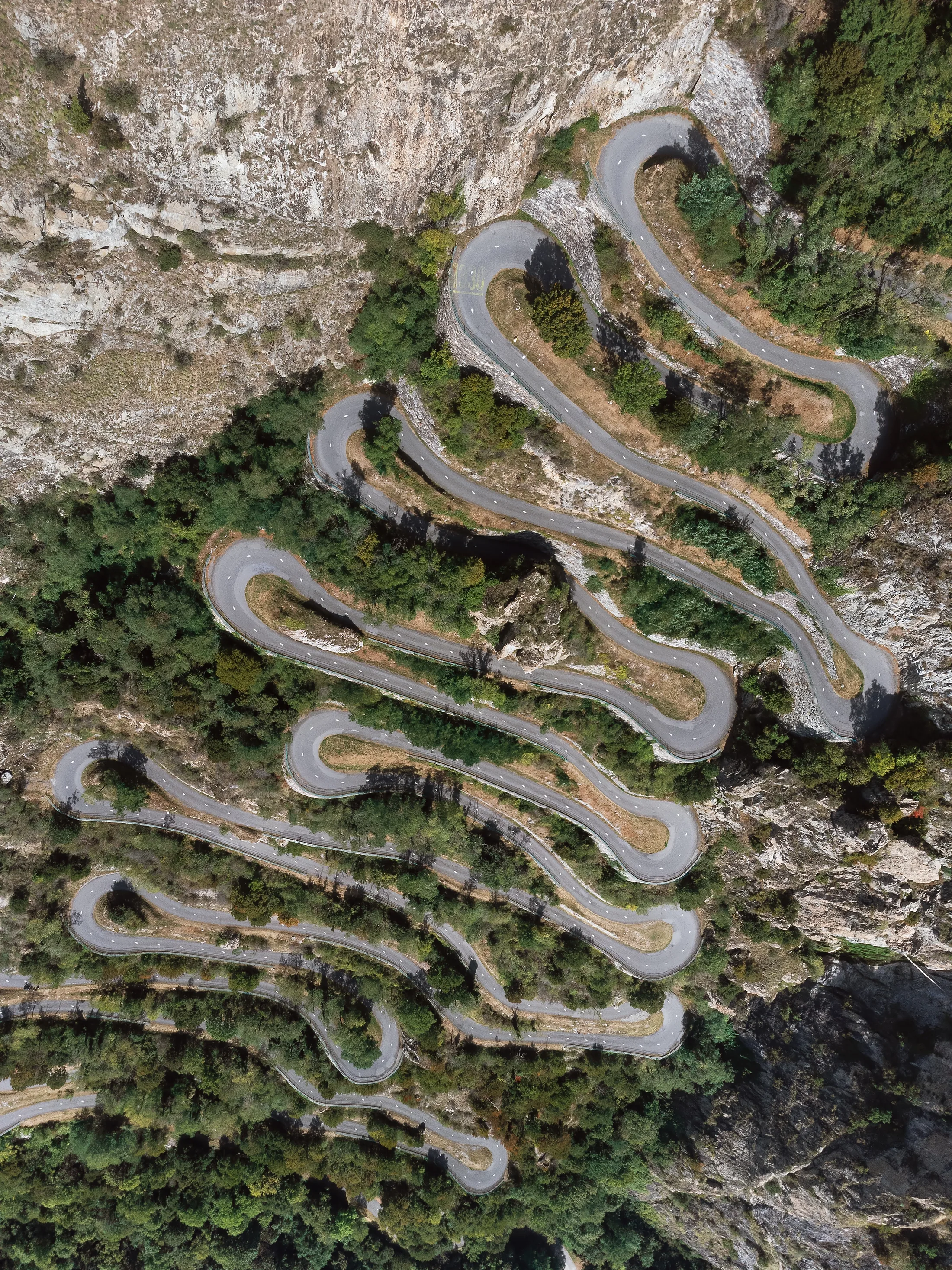 Mountain hairpin road through difficult terrain