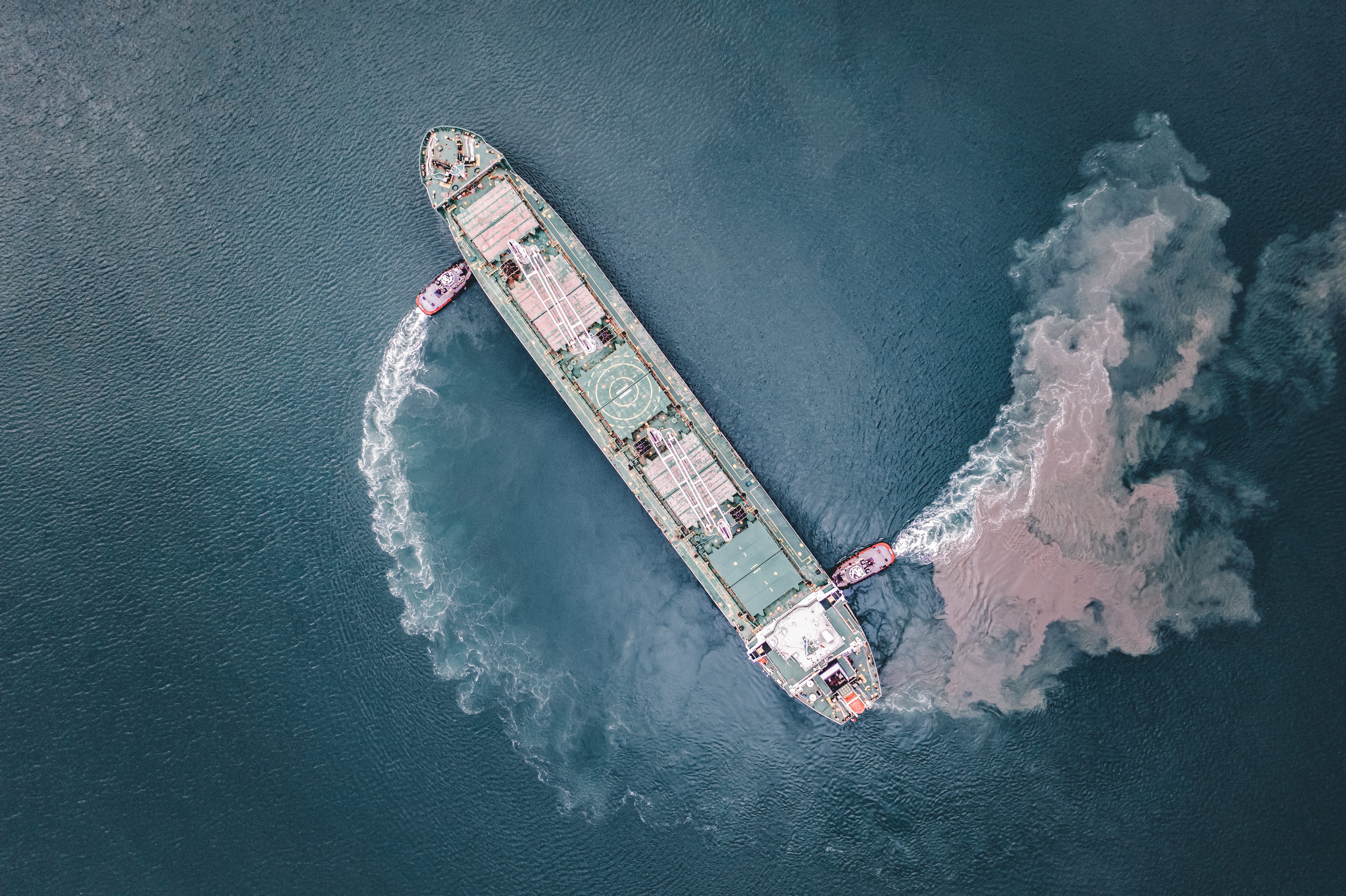Cargo ship moving through open water.